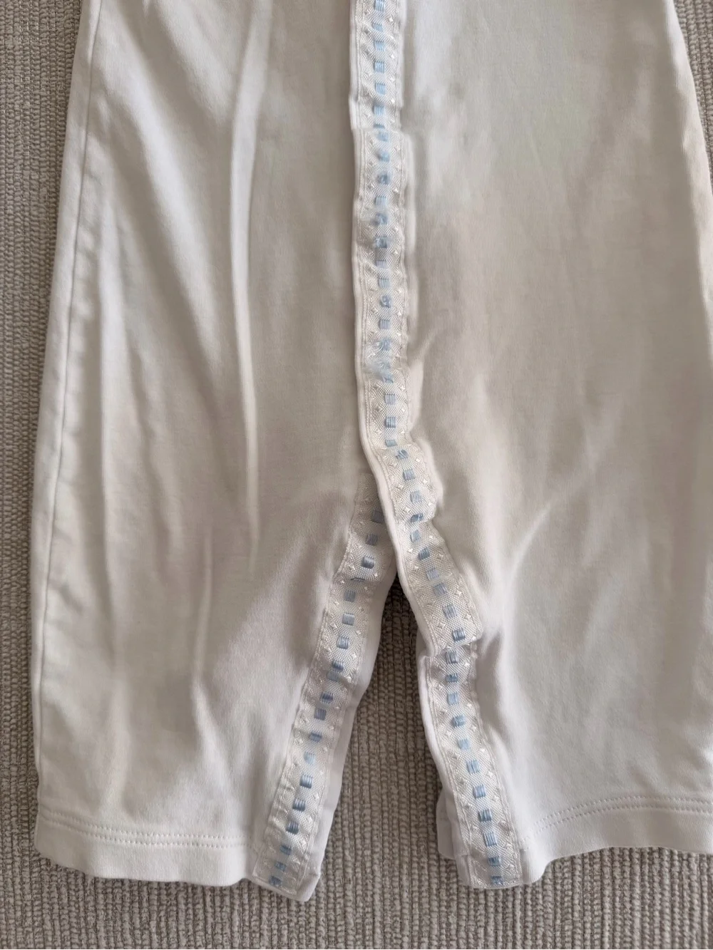 White Footless Baby Onsie with Blue Trim